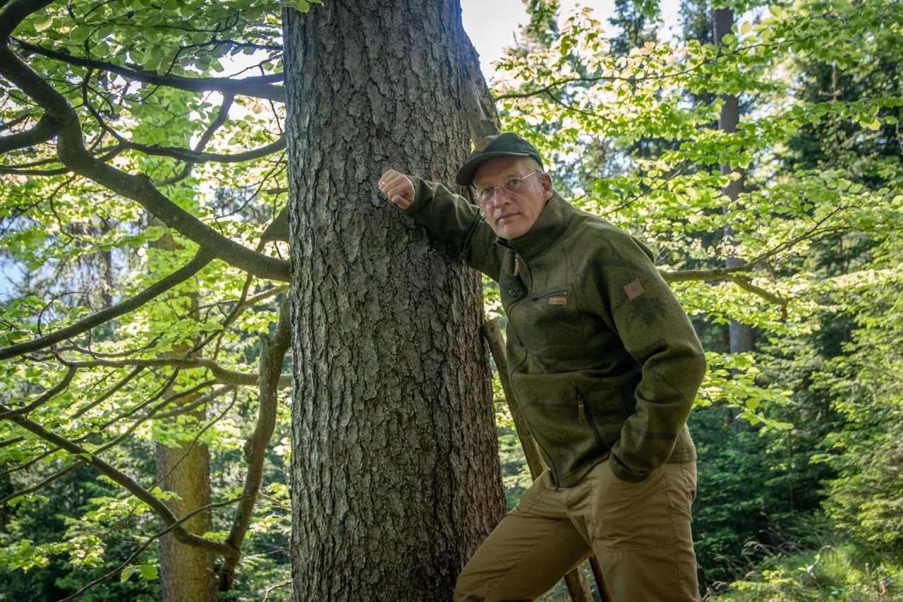 Loden-Tarnjacke Verschwindibus